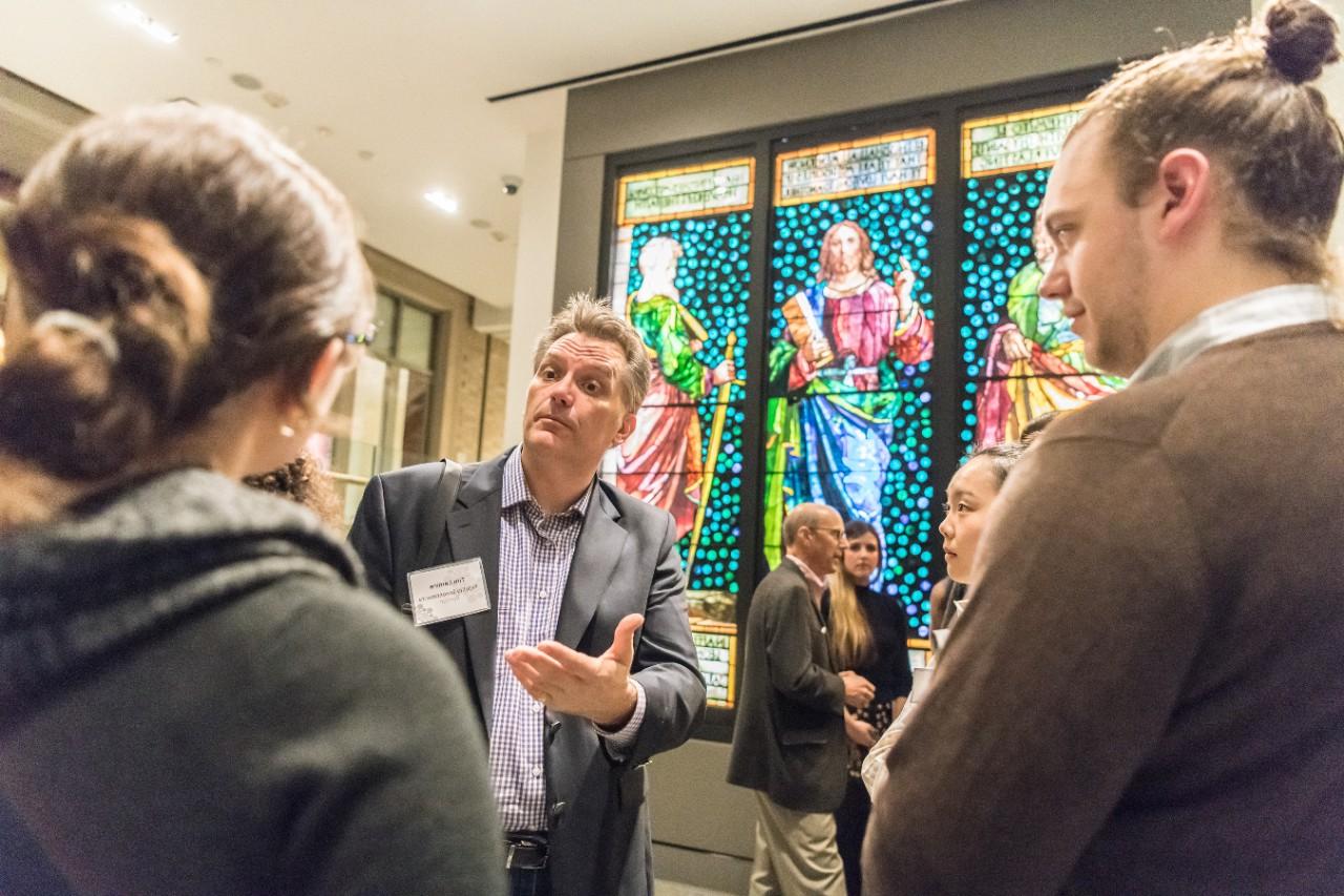 Career Night for the Arts at the McMullen Museum. Tim Lemire of Fidelity Investments talks with students.