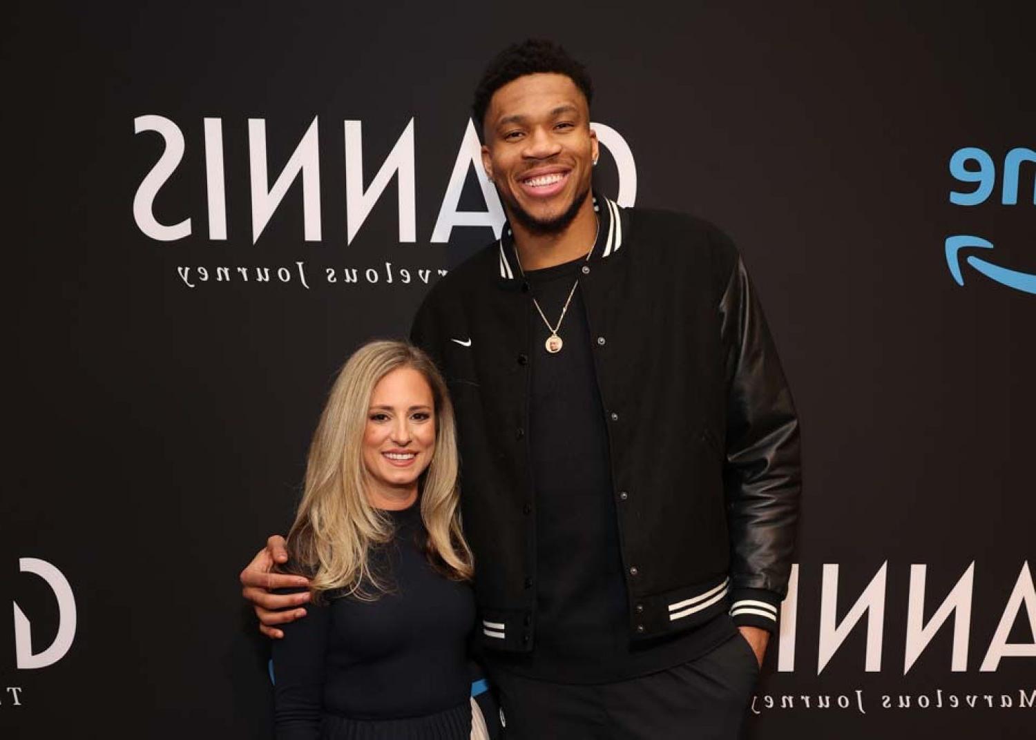 Giannis Antetokounmpo and Kristen Lappas standing together at premiere.